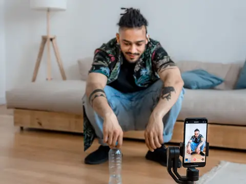 Recording a video in a living room with a phone on a stabilizer